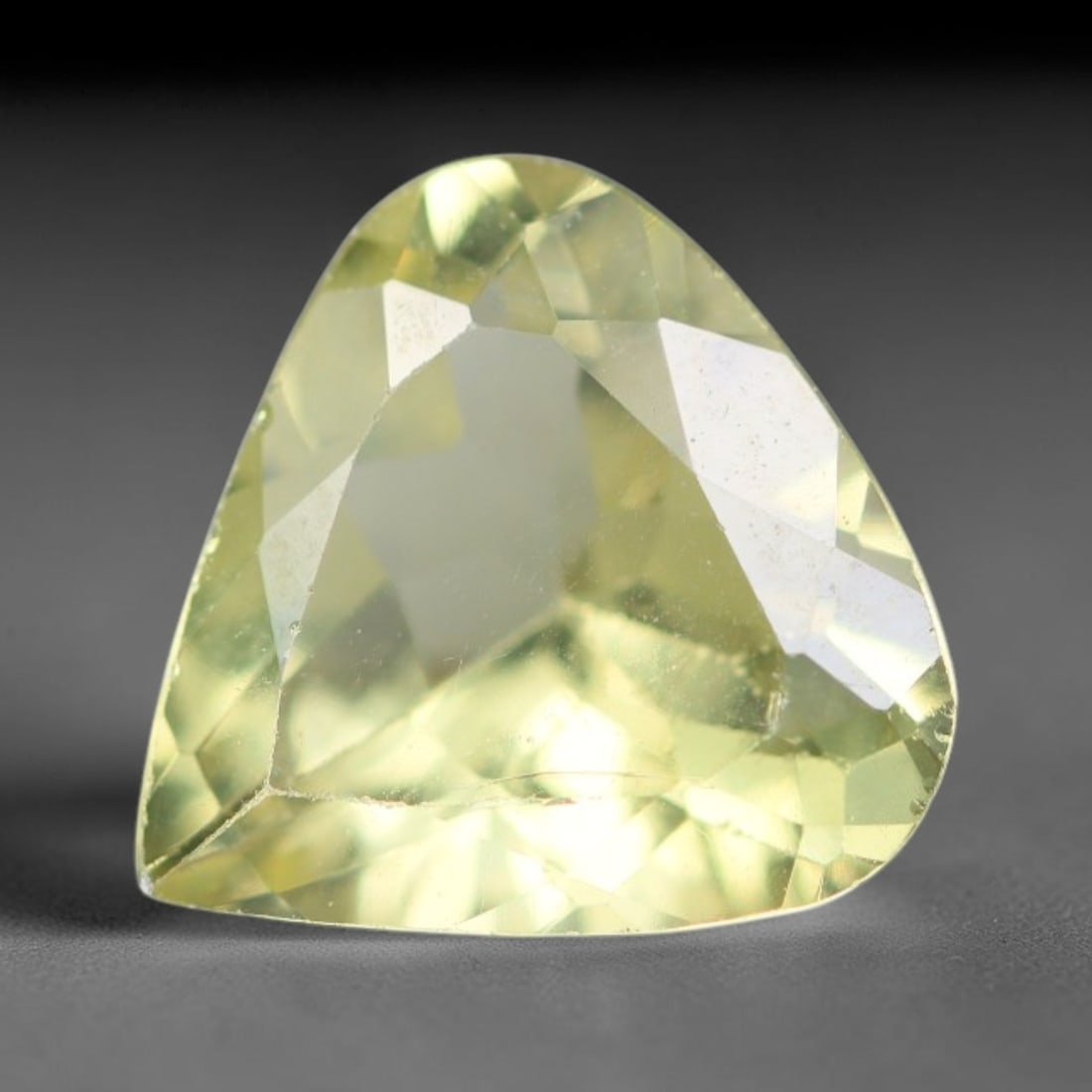 2.61 Carats Natural Pale Yellow Apatite Faceted Loose Gemstone, 49XY: This apatite specimen is sourced from natural geological deposits and shaped with professional faceting and high-gloss polishing work across the outer facet surfaces. Minute internal mineral inclusion