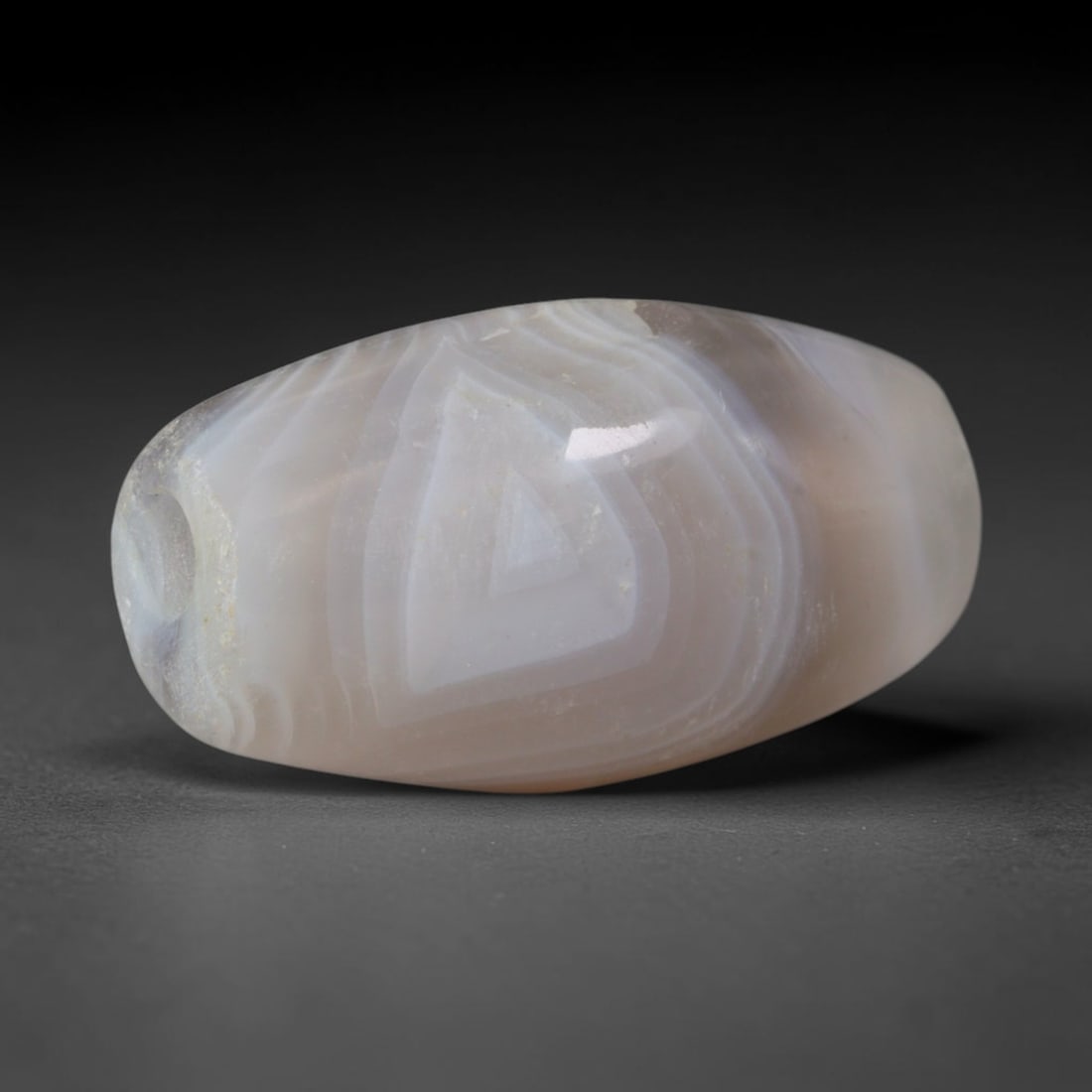 Ancient Bactrian & Greco-Bactrian Cultures Banded Agate Barrel Bead (250 BCE-200 CE), 86XD: This antique banded agate barrel bead originates from Bactrian & Greco-Bactrian Cultures, Central Asian fusion craftsmen blending Greco-Persian beadmaking traditions to produce polished layered agate 