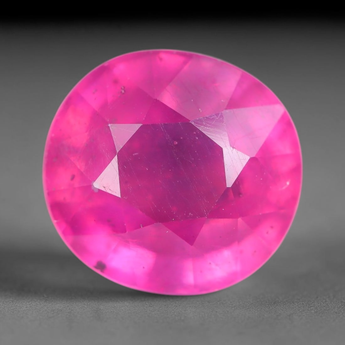 8.12 Carats Natural Mozambique Ruby Oval Faceted Loose Gemstone, 81TH: This natural Mozambique ruby is fashioned with standard oval brilliant faceting, displaying vivid saturated crimson-red hue accompanied by native fine mineral inclusions and subtle trace marks inheren