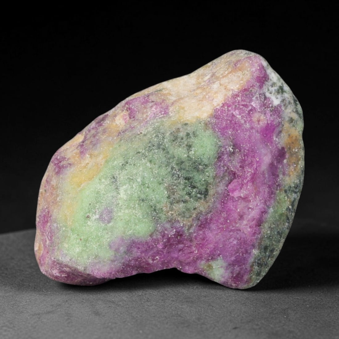 127.23ct Natural Tanzanian Ruby Zoisite Raw Rough Specimen Mineral Stone, 58YT: This unpolished mineral rough is natural ruby zoisite sourced from Tanzania, exhibiting distinct banded mineral segregation of vibrant green zoisite, magenta ruby crystals, and dark hornblende inclusi