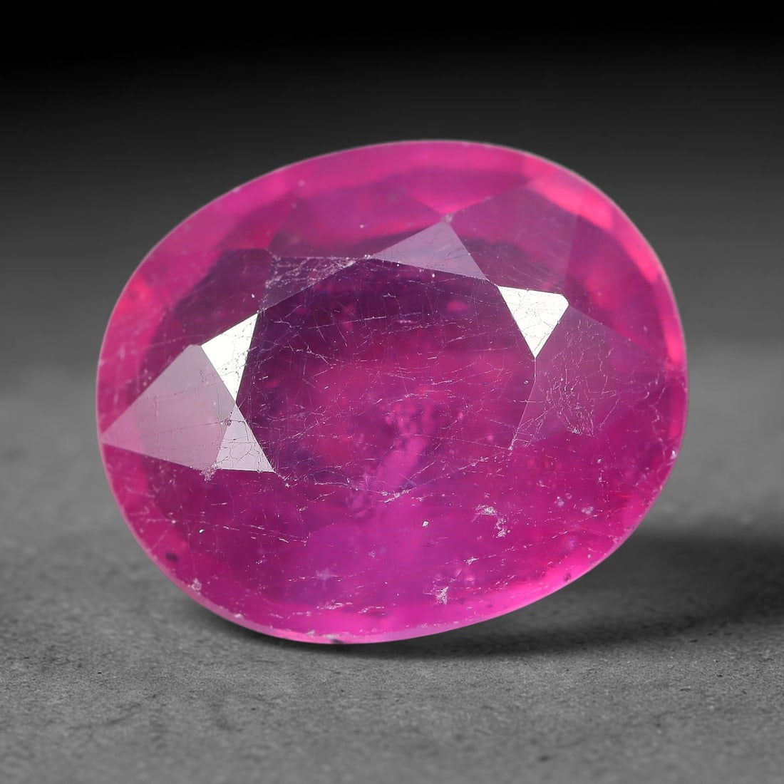 6.34 Carats Natural Mozambique Ruby Oval Faceted Loose Gemstone, 82TH: This natural Mozambique ruby is fashioned with standard oval brilliant faceting, displaying vivid saturated crimson-red hue accompanied by native fine mineral inclusions and subtle trace marks inheren