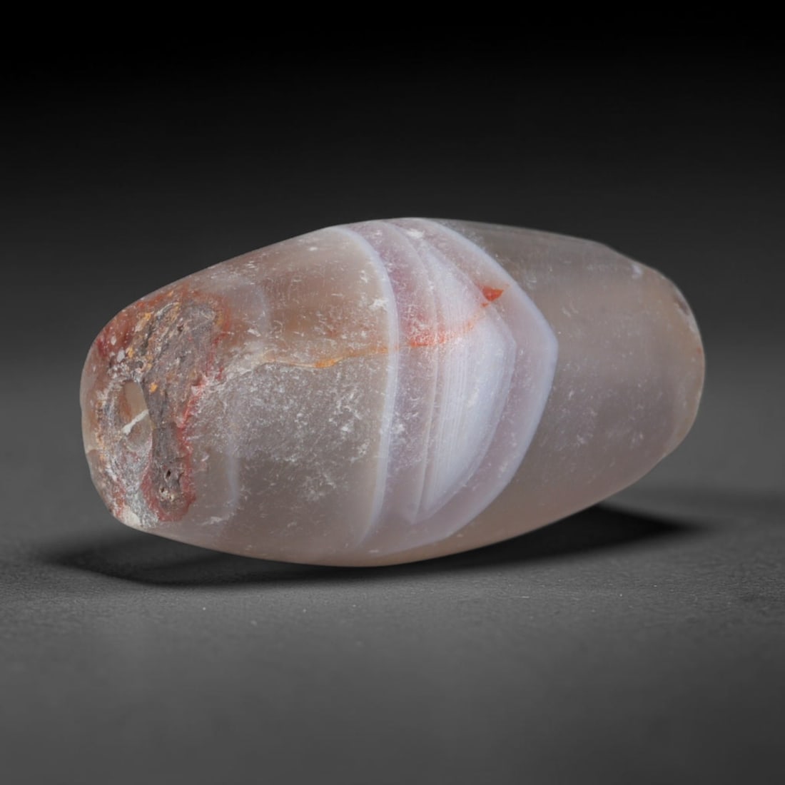 Ancient Parthian Empire Banded Agate Barrel Bead (247 BCE - 224 CE), 98XD: This antique banded agate barrel bead hails from the Parthian Empire, a dominant ancient Iranian power that established widespread agate bead workshops supplying talismans and elite adornments across 