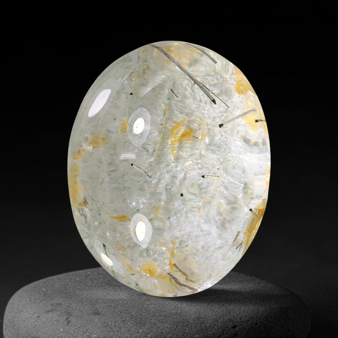 27.34ct Natural Brazilian Black Rutile Quartz Cabochon Loose Gemstone, 5YX: This polished cabochon of natural rutile quartz features countless distinct slender black rutile needle inclusions suspended within the clear quartz host crystal. The smooth domed surface enables full