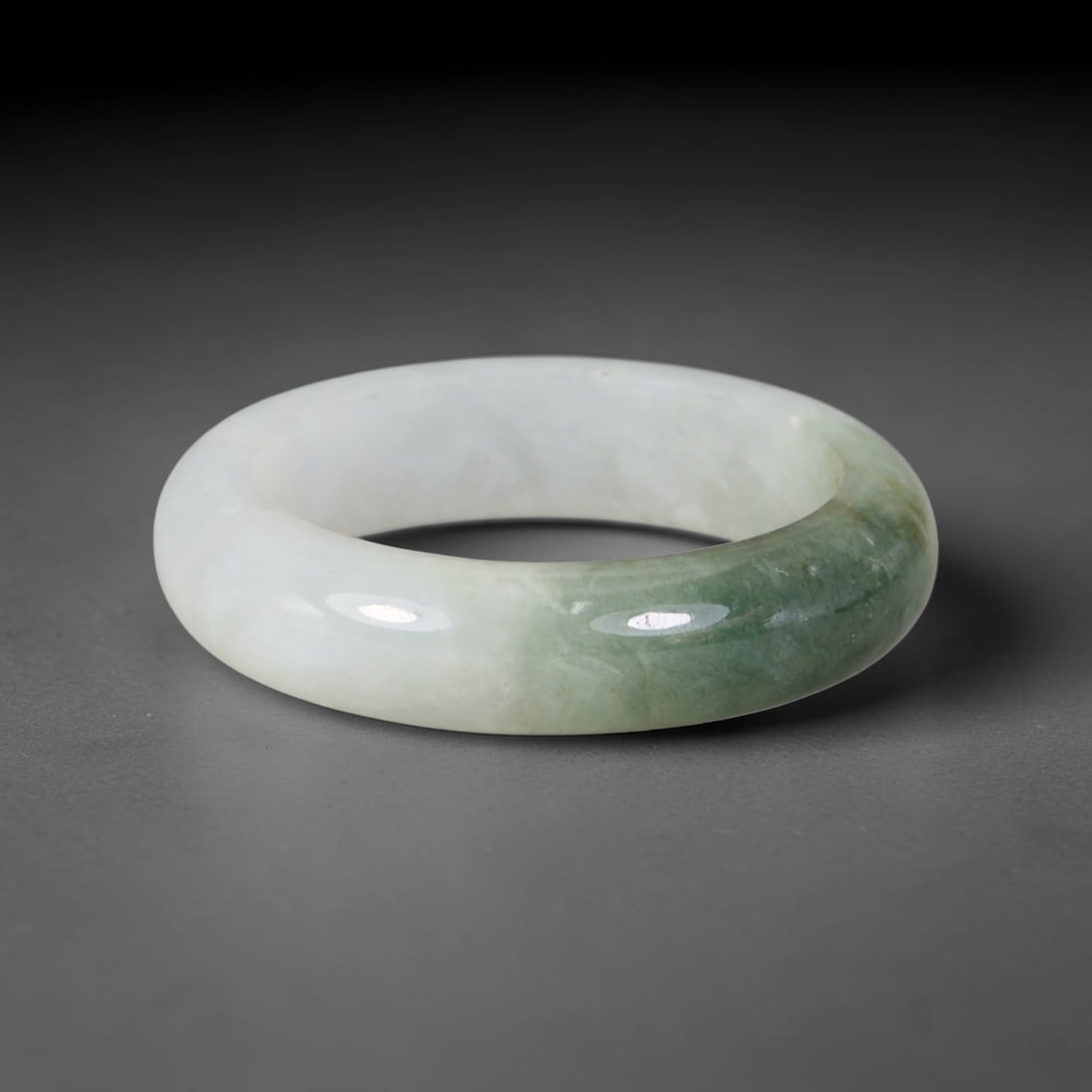 Natural Burmese Type A Jadeite Jade Band Ring Size US 12, 27TB: Crafted from untreated natural Burmese Type A jadeite jade, this solid stone band features a high-gloss polished finish displaying consistent deep green mineral tones interwoven with natural subtle to