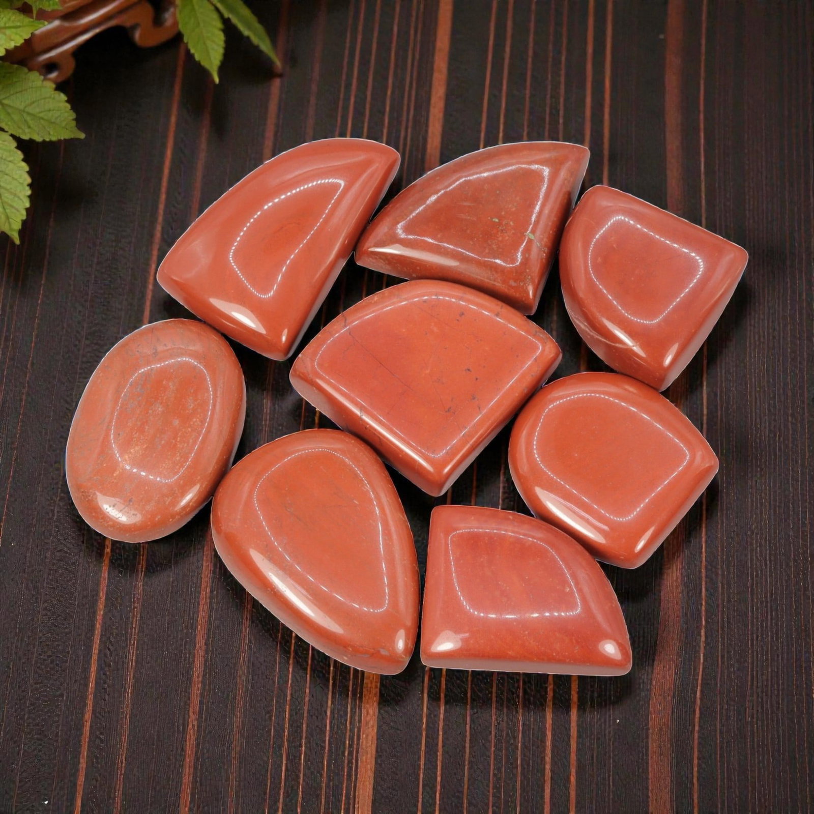 350.58 Carats Natural Red Jasper Cabochon Parcel (8 Pieces), 2WC: This bold set of 8 polished red jasper cabochons features a rich, uniform terracotta-red hue, with subtle natural mineral flecks and faint veining visible across the smooth, high-gloss surface. The ca