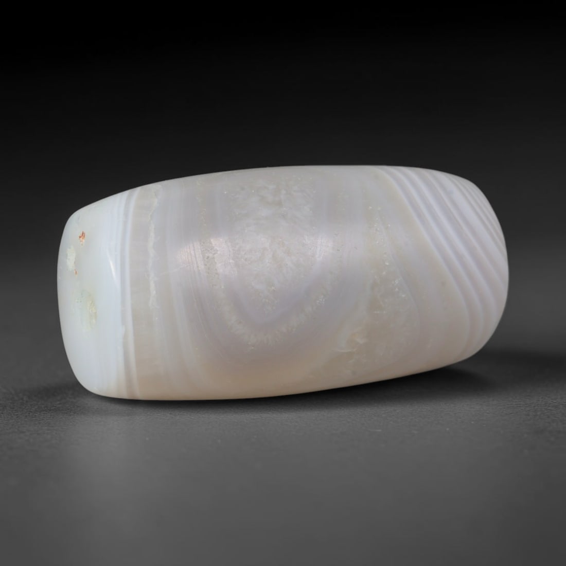 Ancient Indus Valley / Harappan Civilization Banded Agate Cylinder Bead (2600-1900 BCE), 6XV: This antique banded agate cylinder bead hails from the Indus Valley / Harappan Civilization, the ancient South Asian culture that pioneered standardized agate drilling, polishing and banded bead craft