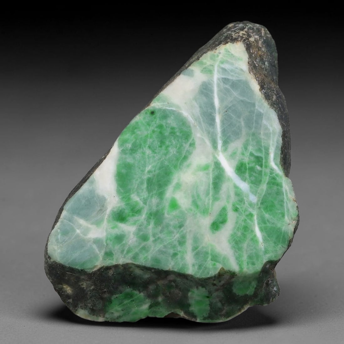 201ct Natural Type A Burmese Jadeite Jade Sliced Rough, 64YN: This specimen is a sliced rough block of natural Type A Burmese jadeite jade. The interior displays natural colour zoning with visible mineral veining and crystalline patterns typical of unprocessed j