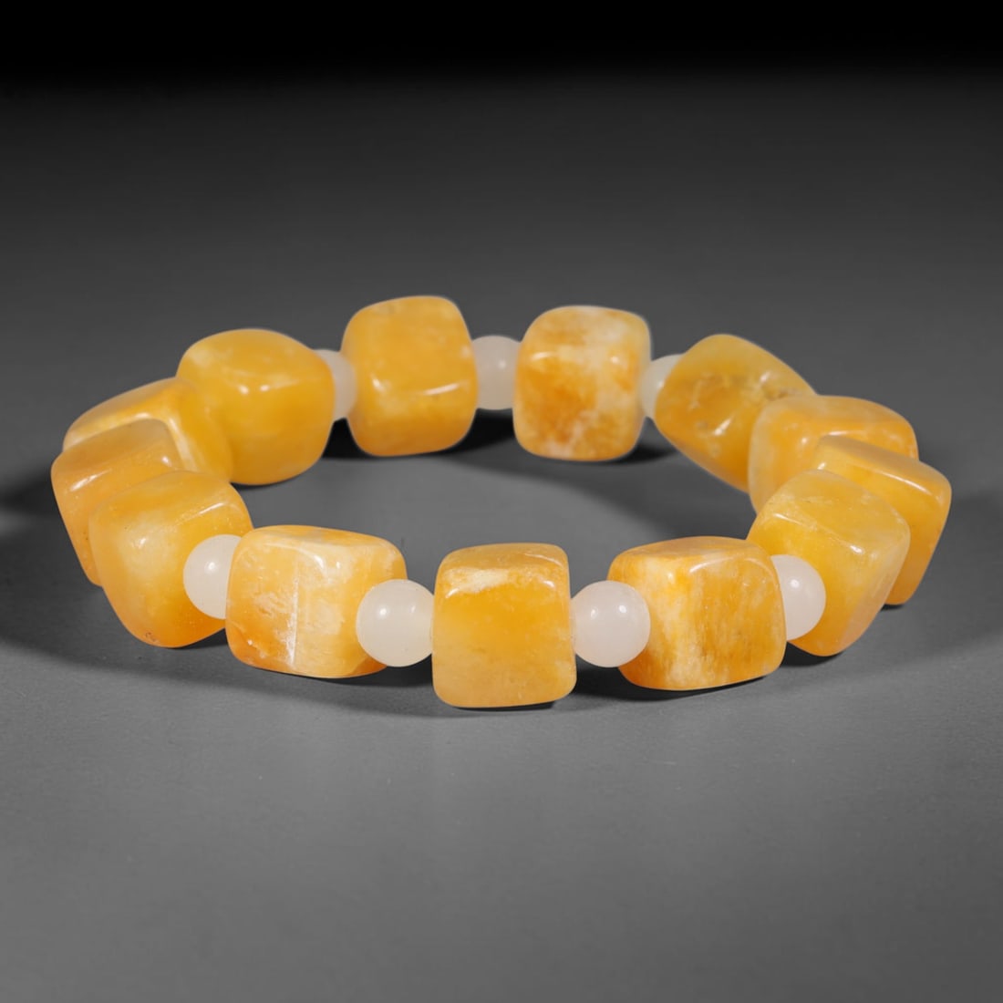 Natural Warm Golden Yellow Square Cube Gemstone Beaded Bracelet, 21TA: Exquisitely handcrafted bracelet featuring smooth rounded square cube natural golden yellow gemstone beads, accented with milky white jadeite spacer beads between each cube. Each stone carries soft na