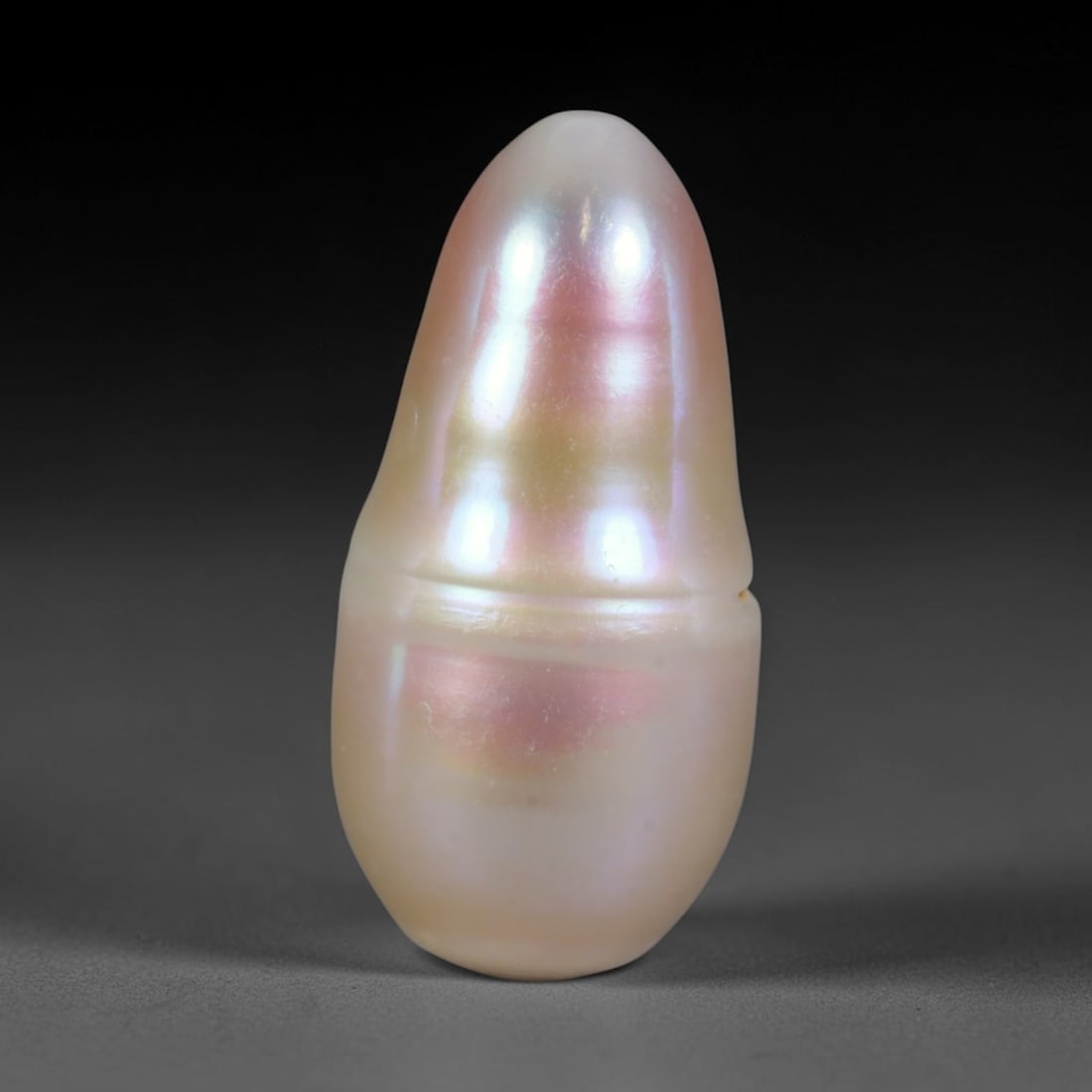 Natural Freshwater Baroque Pearl - Cream Blush Elongated Form, 78WE: This natural freshwater baroque pearl displays an organic elongated silhouette covered in smooth glossy iridescent nacre with soft cream base tones blended with delicate blush pink iridescent overtone