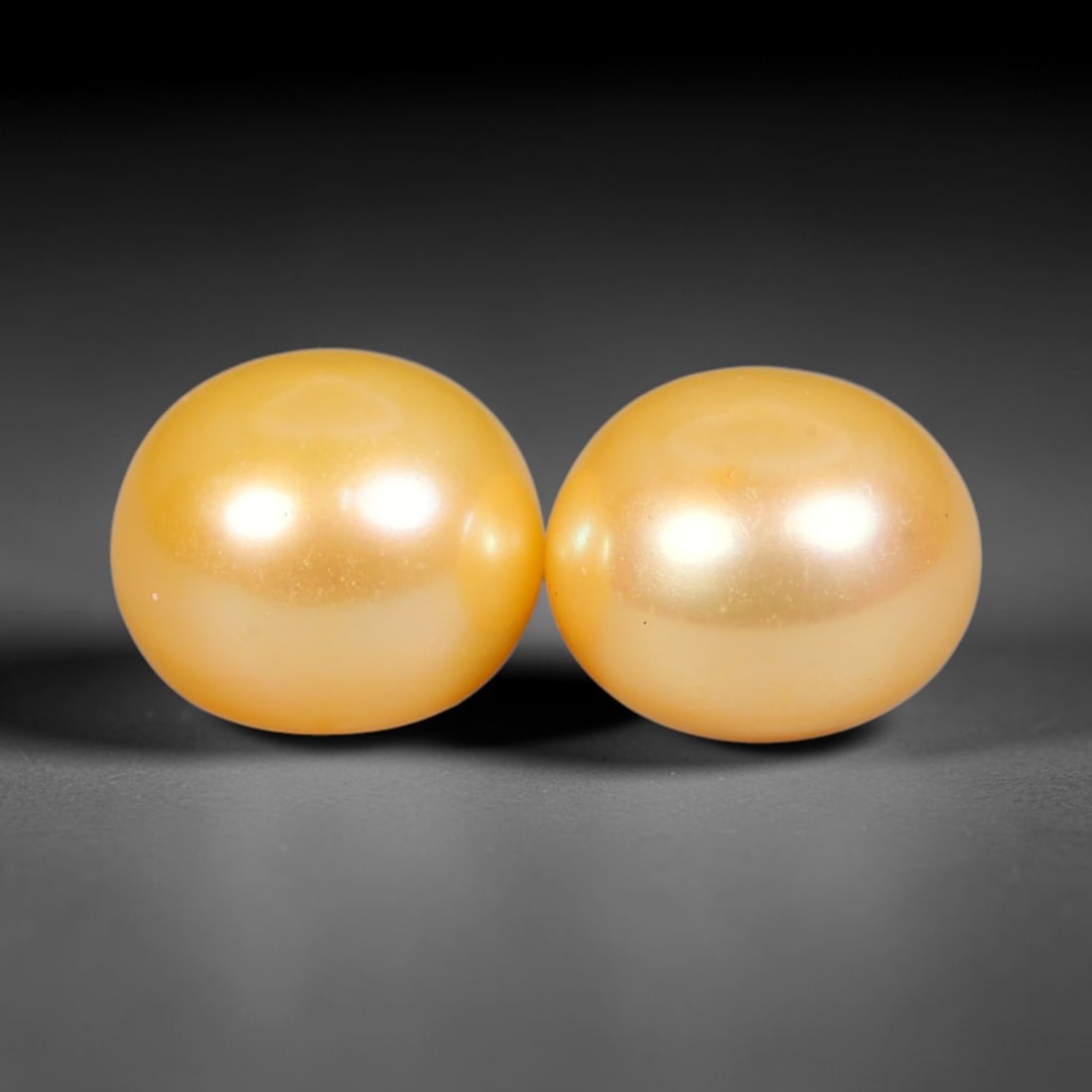 8.83ct Natural Warm Golden Yellow Orient Freshwater Half Round Pearl Pair, 50XZ: Matching pair of color-enhanced freshwater half-round pearls measuring 9.1x7.2mm each, crafted with smooth domed silhouettes ideal for earring mounting. The pearls feature a rich saturated warm golden