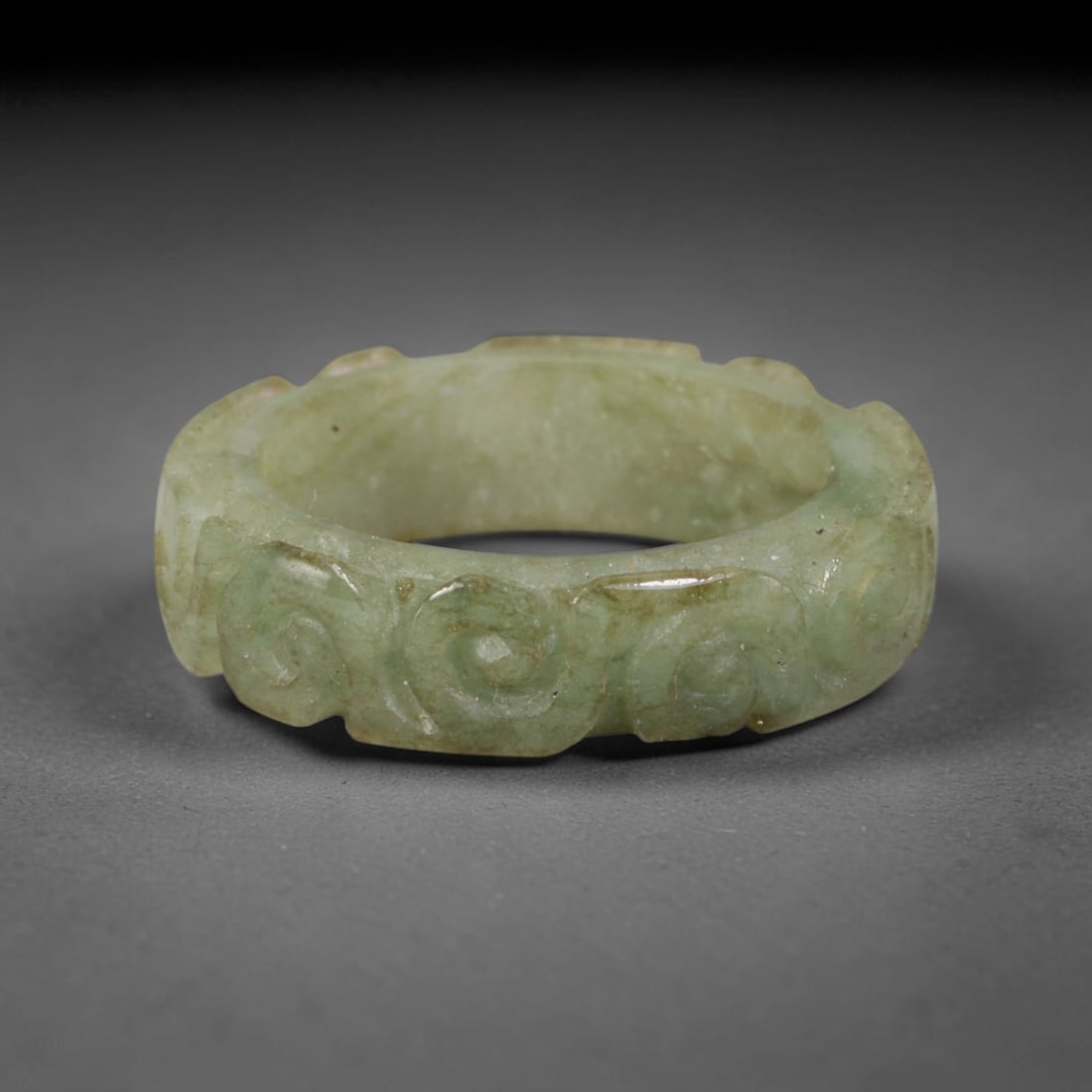 Natural Burmese Type A Jadeite Jade Carving Band Ring Size US 11.5, 24TB: Carved from untreated natural Burmese Type A jadeite jade, this carved stone band holds a soft polished finish showcasing milky pale base hues interspersed with warm natural brown mineral patina patch