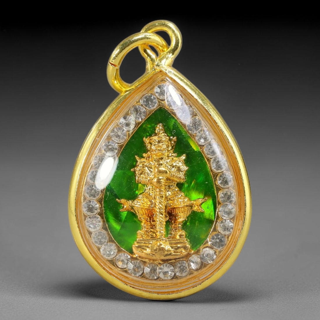 Thai Thao Wessuwan Giant God Dual-Sided Gold Plated Rhinestone Casing Amulet, 79YY: Mini teardrop-shaped Thai Thao Wessuwan amulet with gold metal core sealed under transparent protective cover, encased in polished gold-plated metal frame lined with round clear rhinestones, complete 