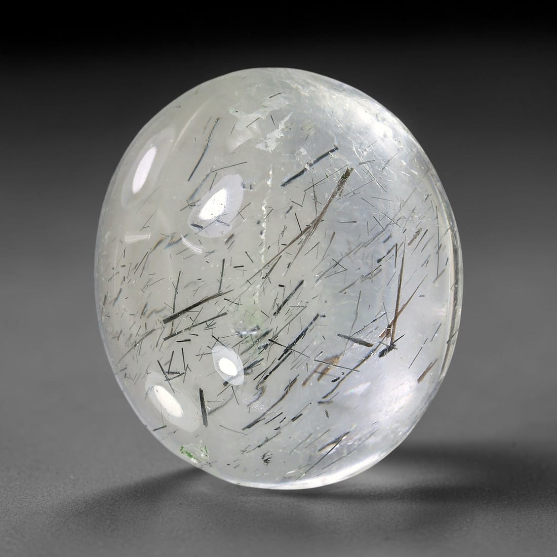 36.26ct Natural Brazilian Black Rutile Quartz Cabochon Loose Gemstone, 15YX: This polished cabochon of natural rutile quartz features countless distinct slender black rutile needle inclusions suspended within the clear quartz host crystal. The smooth domed surface enables full