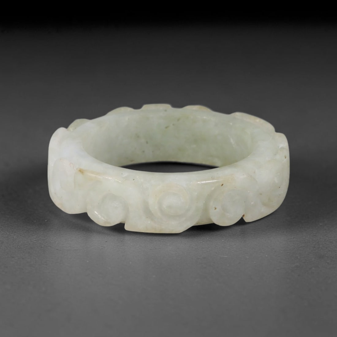 Natural Burmese Type A Jadeite Jade Carving Band Ring Size US 8.5, 22TB: Carved from untreated natural Burmese Type A jadeite jade, this carved stone band holds a soft polished finish showcasing milky pale base hues interspersed with warm natural brown mineral patina patch