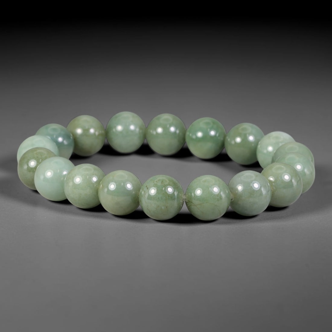 Natural Burmese Type A Soft Light Celadon Green Jadeite Jade Beaded Bracelet, 14TA: Crafted from fully untreated authentic Burmese Type A jadeite, this bracelet features smoothly polished medium-large round beads with a uniform soft light celadon green tone and faint natural subtle m