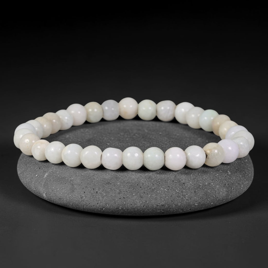 Natural Burmese Type A Pale Off-White Cream Jadeite Jade Bead Bracelet, 44TP: Strung from natural Type A Burmese jadeite, this spherical bead bracelet has a soft pale off-white cream base tone with subtle faint natural clouding and minor warm flecks across the beads. Each bead 
