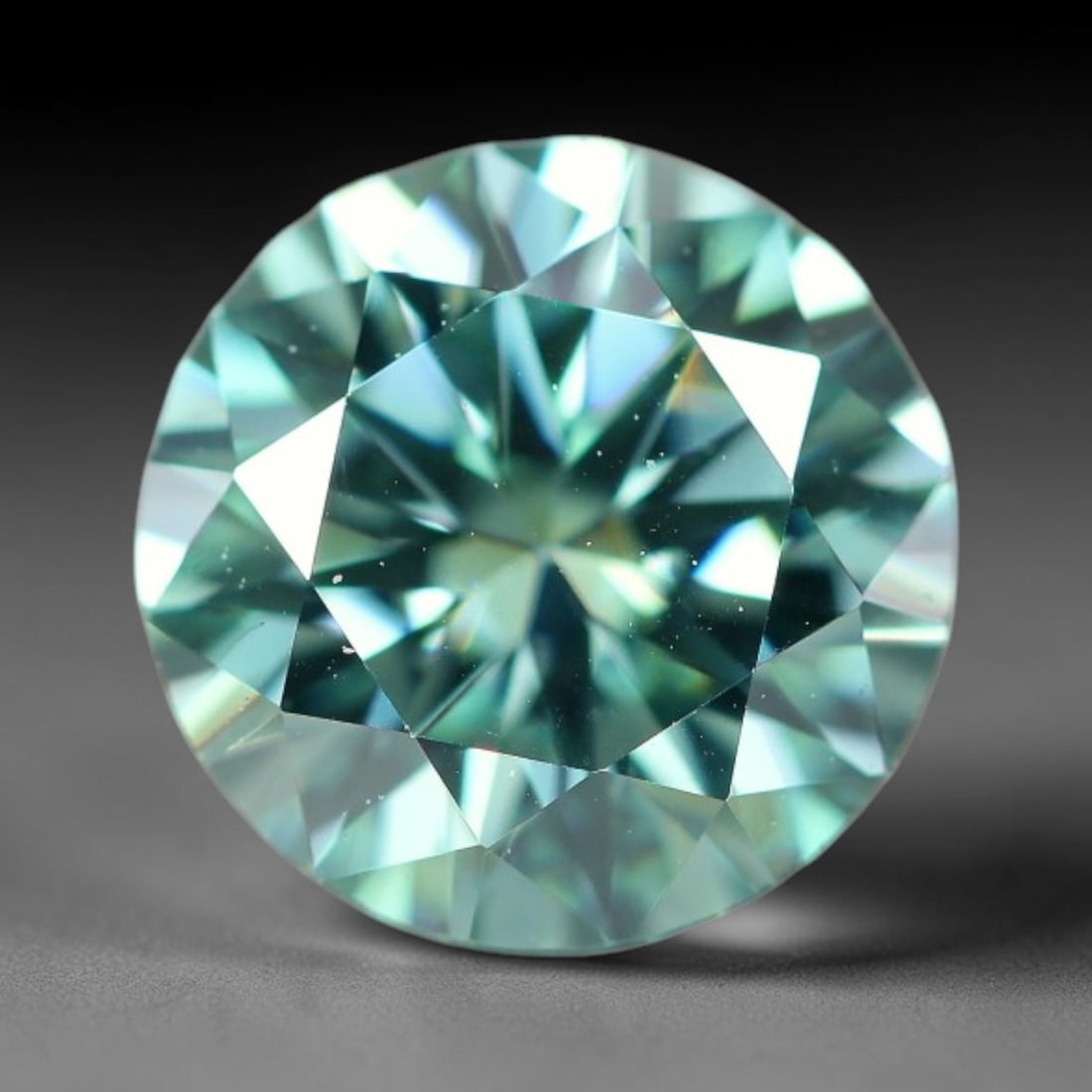 0.97 Carats Aqua Toned Moissanite Loose Gemstone, 72WP: This moissanite features dimensional measurements of 6.4x3.9mm, lab-grown silicon carbide material valued for superior light refraction that delivers vivid multi-hued sparkle across all lighting condi