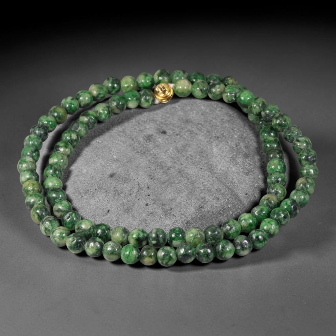 Natural Burmese Type A Dark Mottled Spinach Green Round Jadeite Jade Beaded Necklace, 46TF: Hand-strung bead necklace crafted from genuine untreated Type A Burmese jadeite round beads, featuring deep spinach green base with irregular mottled dark green flecks and marbling. Completed with a p