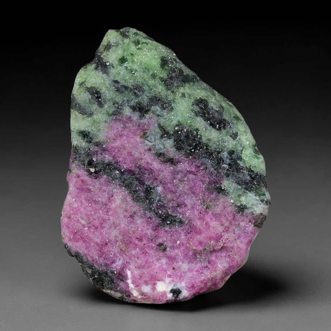 53ct Natural Tanzanian Ruby Zoisite Raw Rough Specimen Mineral Stone, 22YQ: This unpolished mineral rough is natural ruby zoisite sourced from Tanzania, exhibiting distinct banded mineral segregation of vibrant green zoisite, magenta ruby crystals, and dark hornblende inclusi