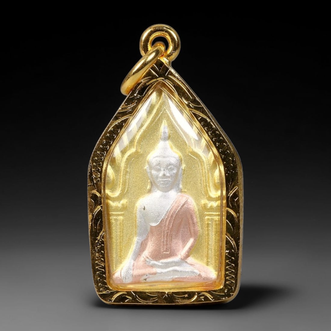 Thai Two-Sided Buddha Tri-Tone Votive Amulet - Gold Cased Pendant, 18YY: Compact pointed shrine-shaped devotional pendant fitted with polished engraved gold casing, transparent protective cover and integrated hanging bail. The front panel features a silver seated Buddha re