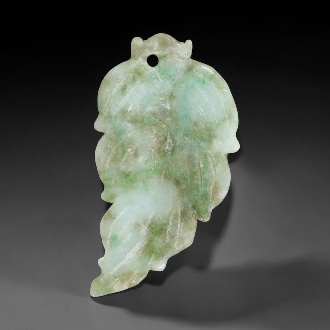 Natural Burmese Type A Jadeite Jade Hand Carved Pendant, 19TC: Artisan hand-carved untreated Burmese Type A jadeite jade pendant measuring 46.6x25 mm. Carefully sculpted with detailed relief craftsmanship and finished with a smooth glossy polish. Authentic Type A