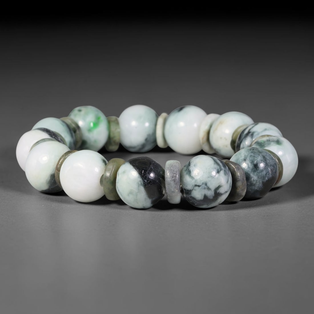 Natural Burmese Type A Cloud Mottled White Green Jadeite Jade Bead Bracelet, 11TP: Strung from natural Type A Burmese jadeite, this large spherical bead bracelet displays a creamy white base blended with soft cloud-like deep grey-green mottling and occasional bright green flecks, pa