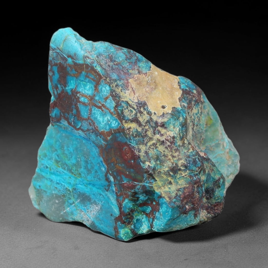 60.52ct Natural Peruvian Chrysocolla Polished Slab Rough, 90YS: This partial-polished chrysocolla slab features blended mineral matrix with smooth refined face and unaltered natural rugged edge across its 30x23x20mm elongated form, translucent mineral layers hold 