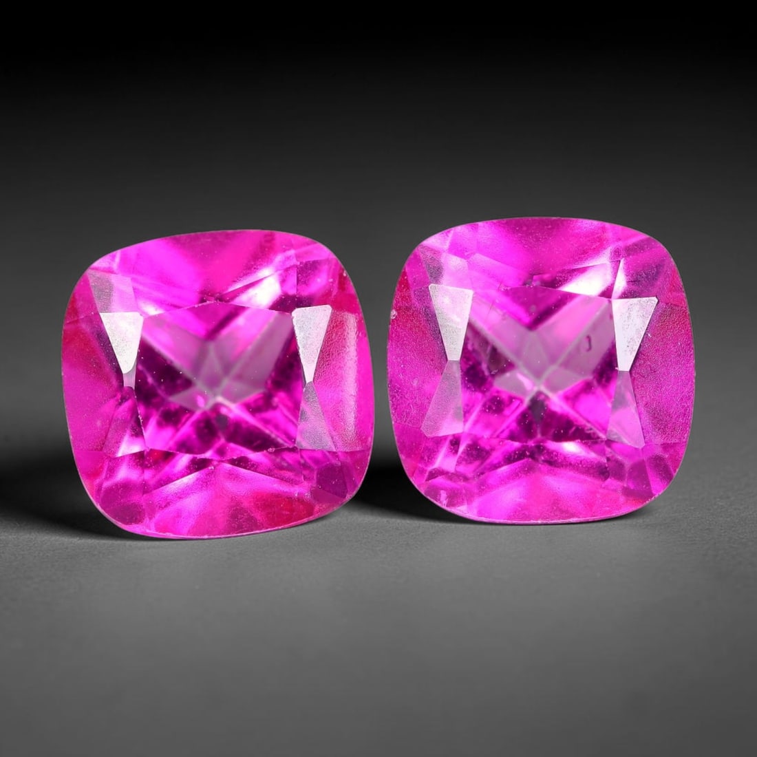 5.80ct Natural Pink Topaz Cushion Cut Matched Pair Loose Gemstones, 93TG: Natural pink topaz fashioned into a matched pair of cushion brilliant cuts with polished table and symmetrical pavilion facets. The stones exhibit a saturated vivid hot pink body color with high trans