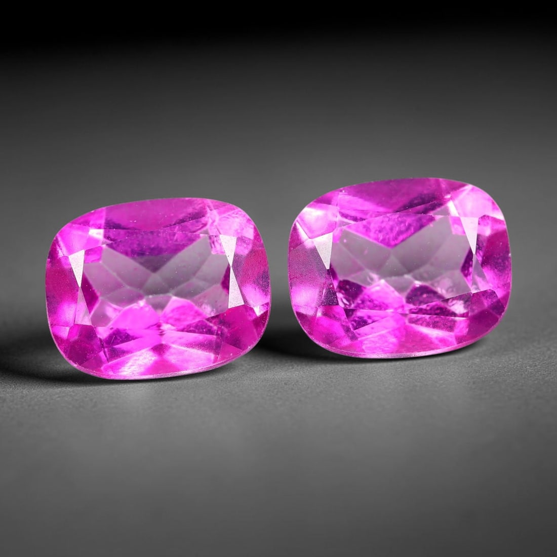 7.31ct Natural Pink Topaz Cushion Cut Matched Pair Loose Gemstones, 91TG: Natural pink topaz fashioned into a matched pair of cushion mixed cuts with polished table and brilliant pavilion facets. The stones display a saturated vivid hot pink body color with excellent transp