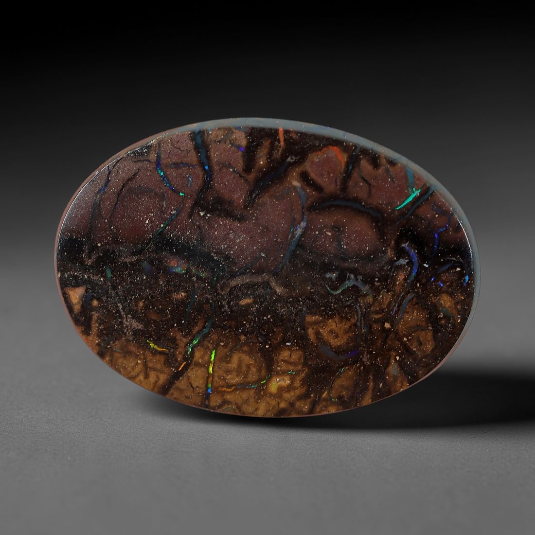 4.26 Carats Koroit Yowah Opal Cabochon - Natural Australian Single Stone, 87XL: This striking Koroit Yowah opal cabochon, measuring 13.4x9.6x3.0mm, features a complex, vein-like ironstone matrix in layered tones of deep plum, rich brown, and warm tan. The matrix is crisscrossed b