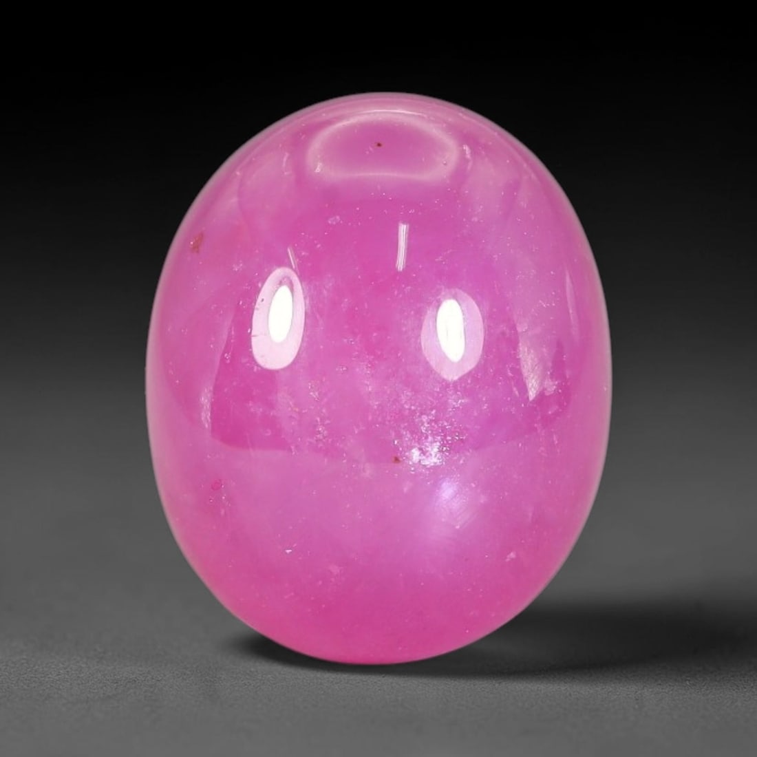 15.18 Carats Natural Mozambique Ruby Cabochon Loose Gemstone, 55TM: This ruby originates from Mozambique natural mineral deposits and receives professional cabochon grinding and polishing treatment to form a smooth glossy exterior surface. Tiny mineral particles and n