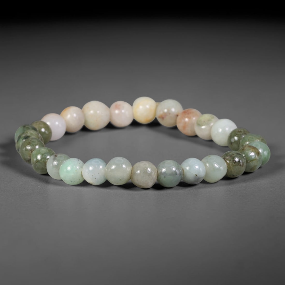 Natural Burmese Type A Multicolor Mixed Jadeite Jade Beaded Bracelet, 19TA: Crafted from untreated natural Burmese Type A jadeite jade beads with maximum bead dimension of 7.50mm, this wearable strand features a gentle polished finish displaying blended natural tones of green