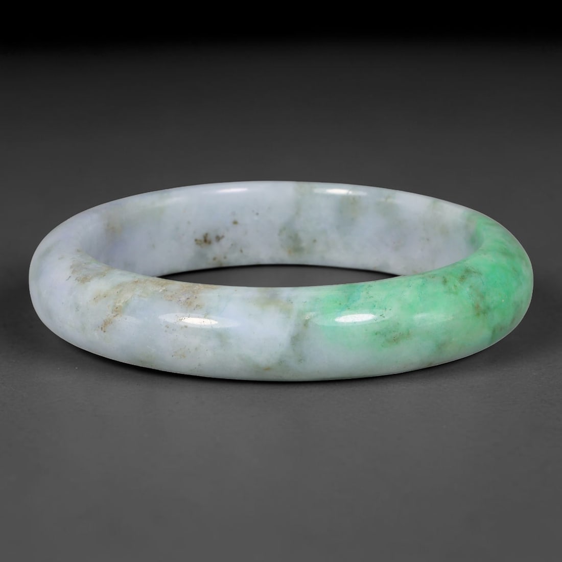 Natural Burmese Type A Jadeite Jade Bangle Bracelet, 6TD: Crafted from natural Burmese type-A jadeite, this wide-band bangle features a pale milky lavender-white base with a prominent patch of bright apple-green concentrated on one side of the hoop. Subtle e