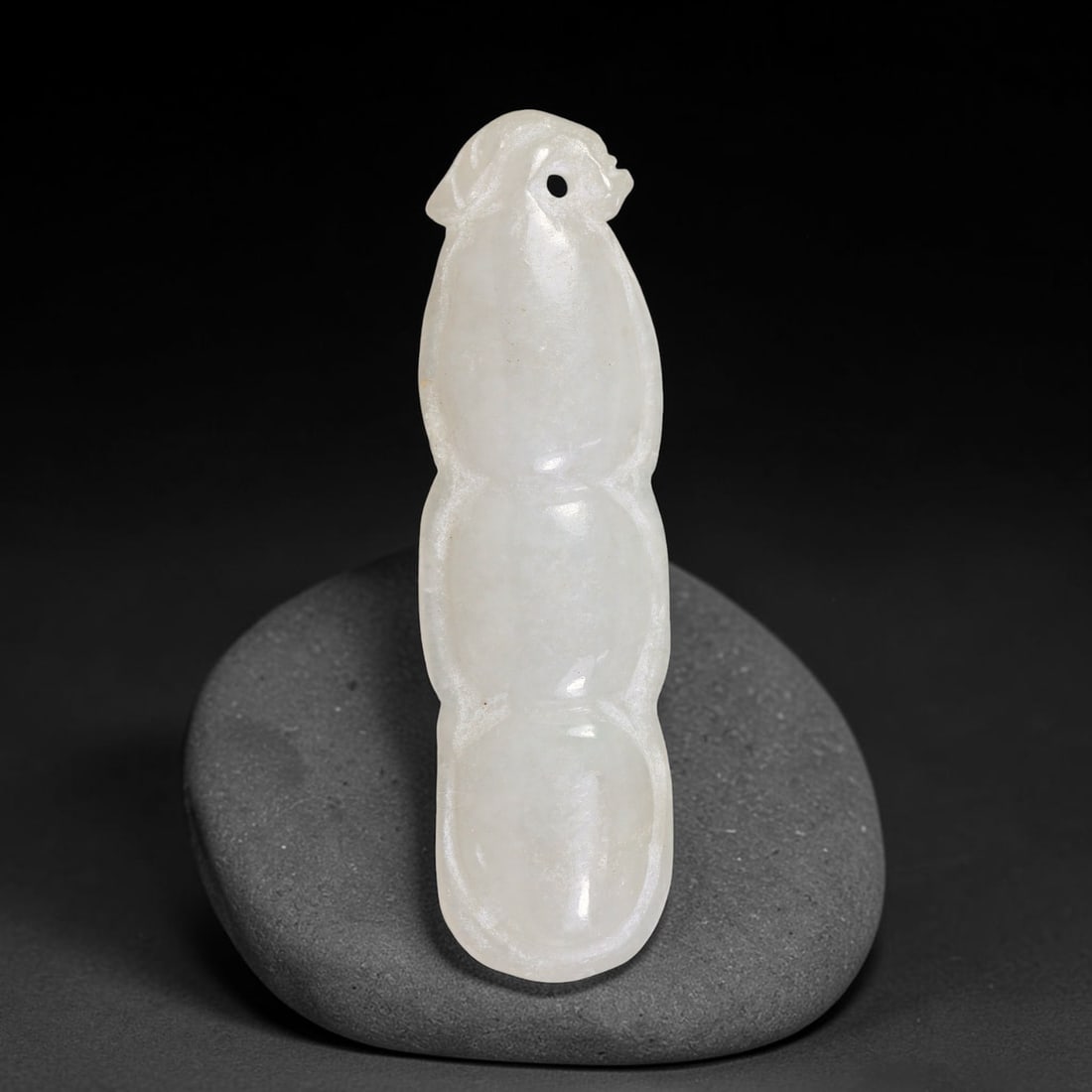 Natural Burmese Type A Jadeite Jade Hand Carved Pendant, 10TC: Artisan hand-carved untreated Burmese Type A jadeite jade pendant measuring 50.8x14.7 mm. Carefully sculpted with detailed relief craftsmanship and finished with a smooth glossy polish. Authentic Type