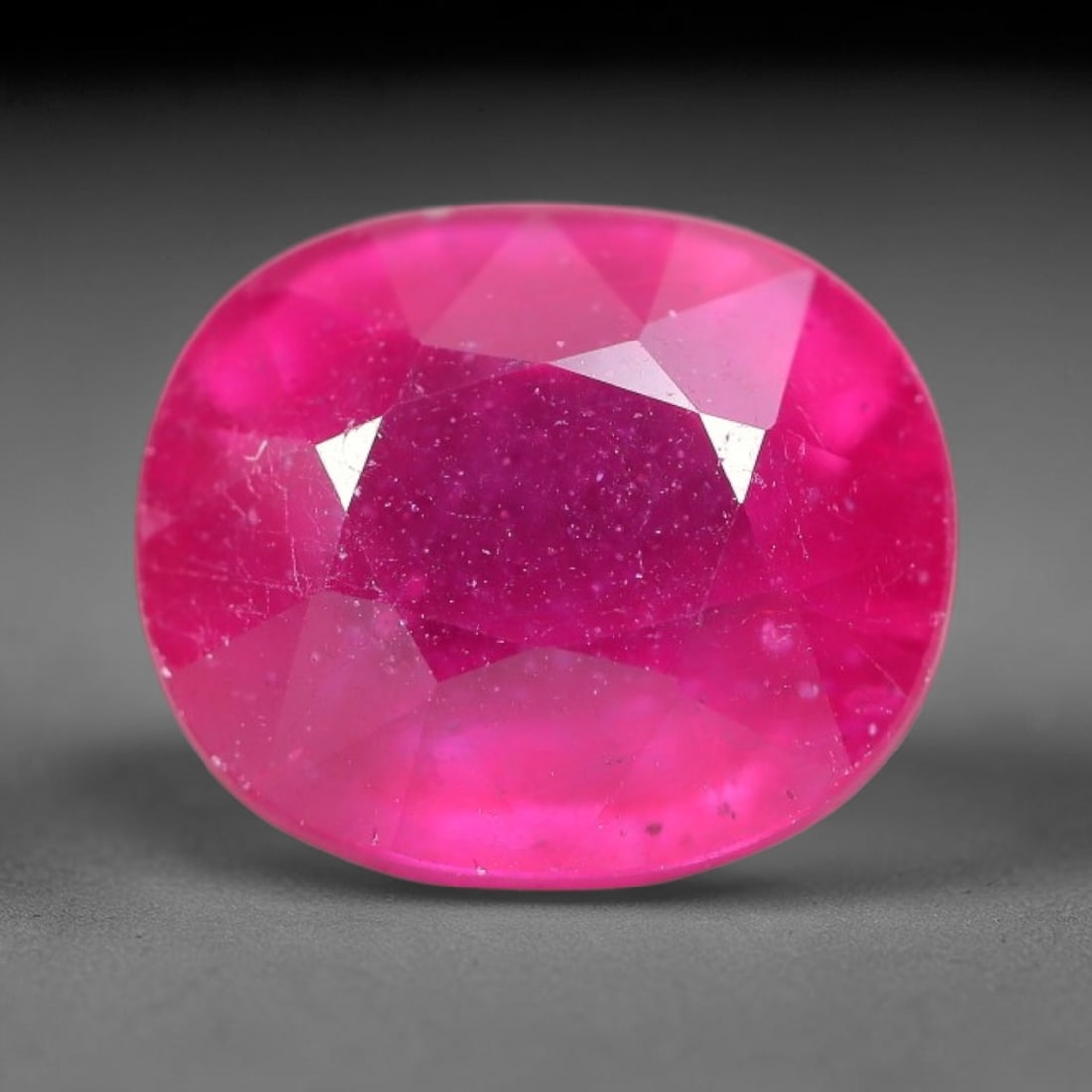 8.20 Carats Natural Mozambique Ruby Oval Faceted Loose Gemstone, 81TM: This natural Mozambique ruby is fashioned with standard oval brilliant faceting, displaying vivid saturated crimson-red hue accompanied by native fine mineral inclusions and subtle trace marks inheren