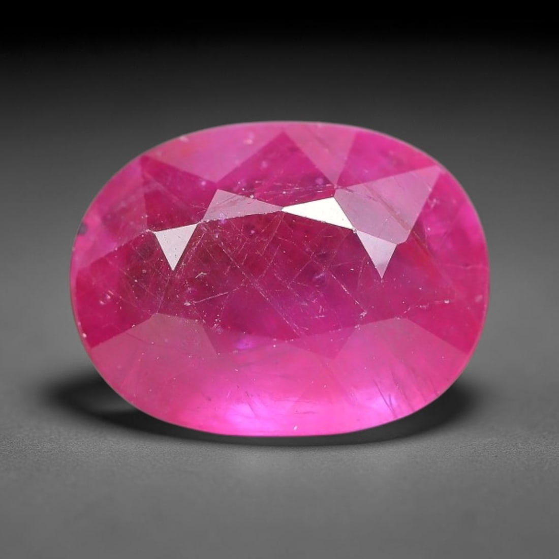 4.87 Carats Natural Mozambique Ruby Oval Faceted Loose Gemstone, 78TM: This natural Mozambique ruby is fashioned with standard oval brilliant faceting, displaying vivid saturated crimson-red hue accompanied by native fine mineral inclusions and subtle trace marks inheren