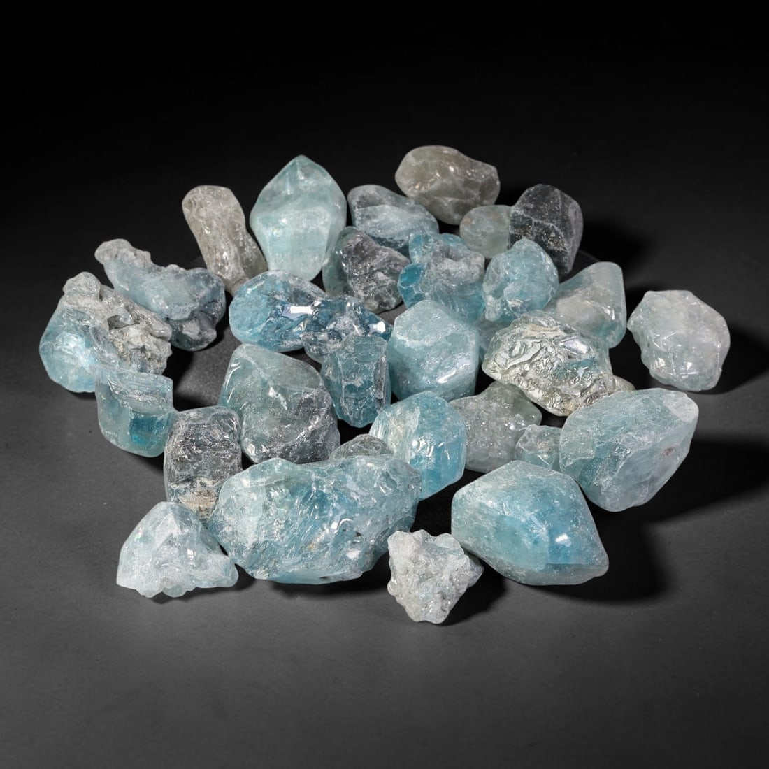230.94ct Natural Cambodian Blue Zircon Rough Parcel Loose Gemstone, 79YT: This parcel consists of natural unpolished blue zircon rough crystals with translucent sky-blue to teal hues, featuring natural crystalline textures and facets. Minor matrix and inclusions are visible