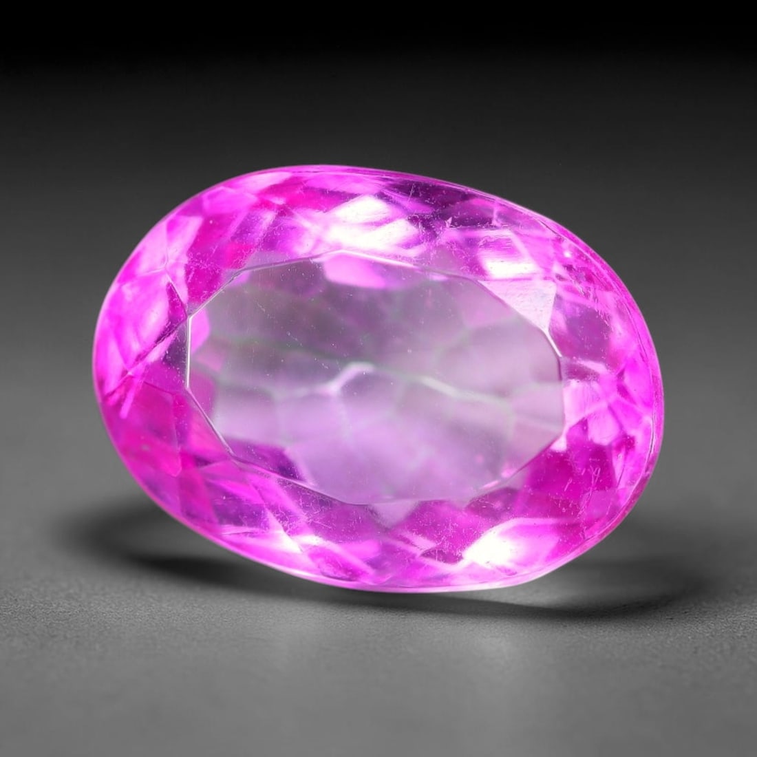 5.70 Carats Natural Brazilian Pink Topaz Oval Faceted Loose Gemstone, 7TM: This specimen is composed of natural topaz sourced from Brazilian mineral deposits, processed via professional faceted lapidary techniques with consistent glossy polishing applied to the entire crysta