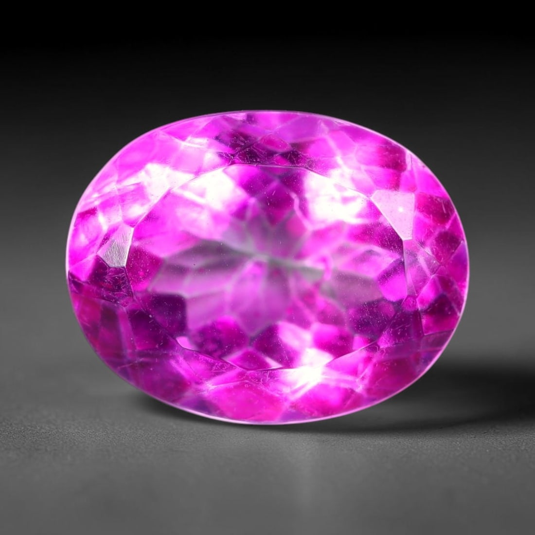 6.58 Carats Natural Brazilian Pink Topaz Oval Faceted Loose Gemstone, 6TM: This specimen is composed of natural topaz sourced from Brazilian mineral deposits, processed via professional faceted lapidary techniques with consistent glossy polishing applied to the entire crysta