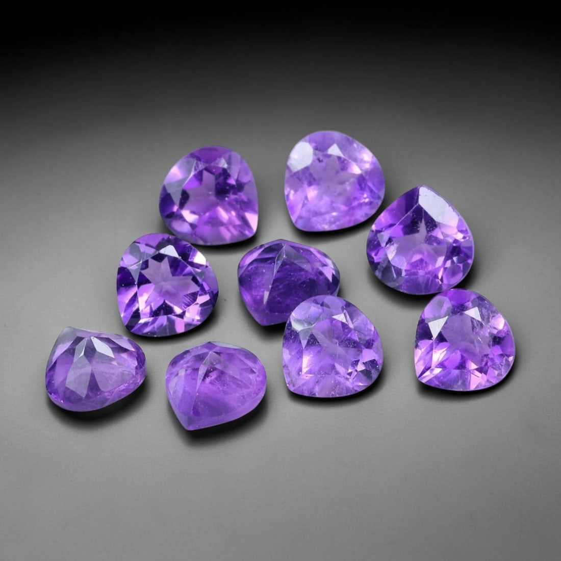 4.14ct Natural Purple Amethyst Trillion Cut Loose Gemstone Parcel, 1TT: This parcel trillion faceted natural amethyst gemstones with aggregate total weight of 4.14 carats, each stone measuring 5.0x3.4mm. The gems exhibit vivid saturated purple colouration with subtle natu
