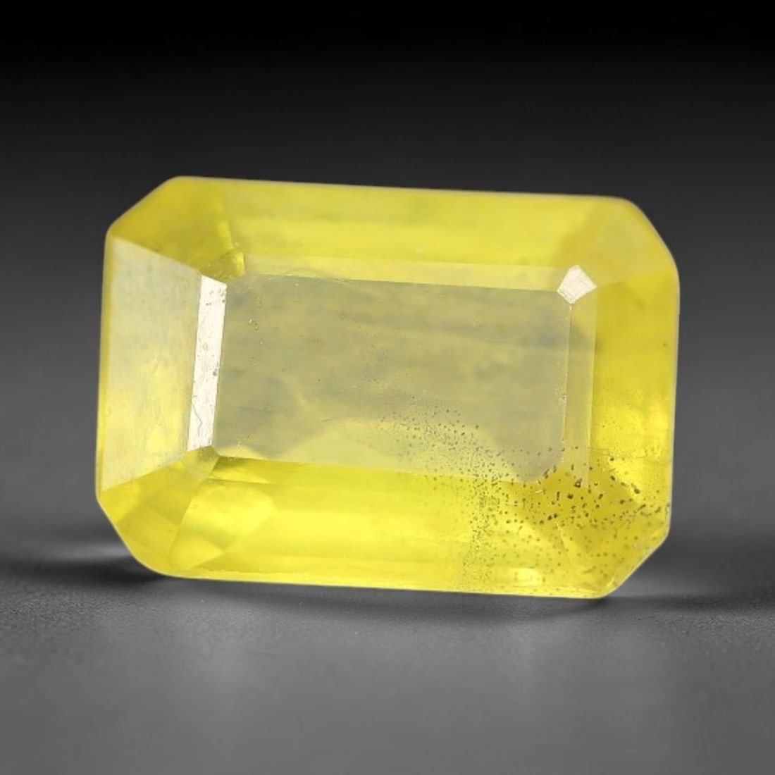 1.18 Carats Natural Yellow Sapphire Octagon Faceted Loose Gemstone, 46TT: This natural yellow sapphire features a classic octagon brilliant faceted cut, holding consistent warm golden-yellow color throughout the corundum crystal. Fine microscopic mineral specks and faint na