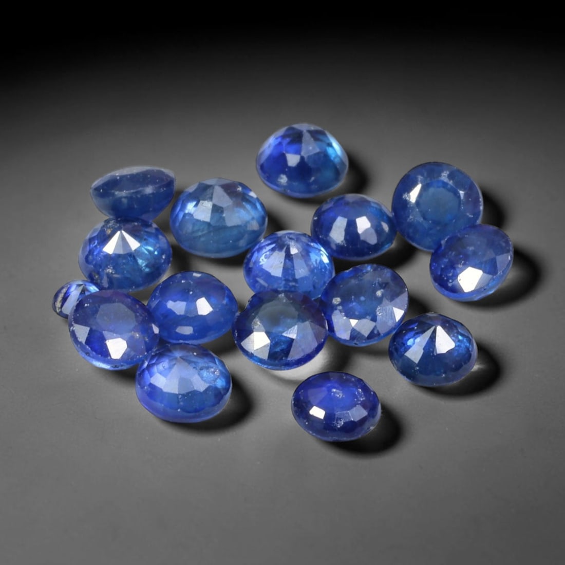 3.16ct Natural Blue Sapphire Round Cut Loose Gemstone Parcel, 8TZ: This parcel round faceted natural blue sapphires with each stone measuring 3.5x2.4mm. The gemstones show saturated deep blue colouration with natural mineral inclusions and subtle internal growth feat