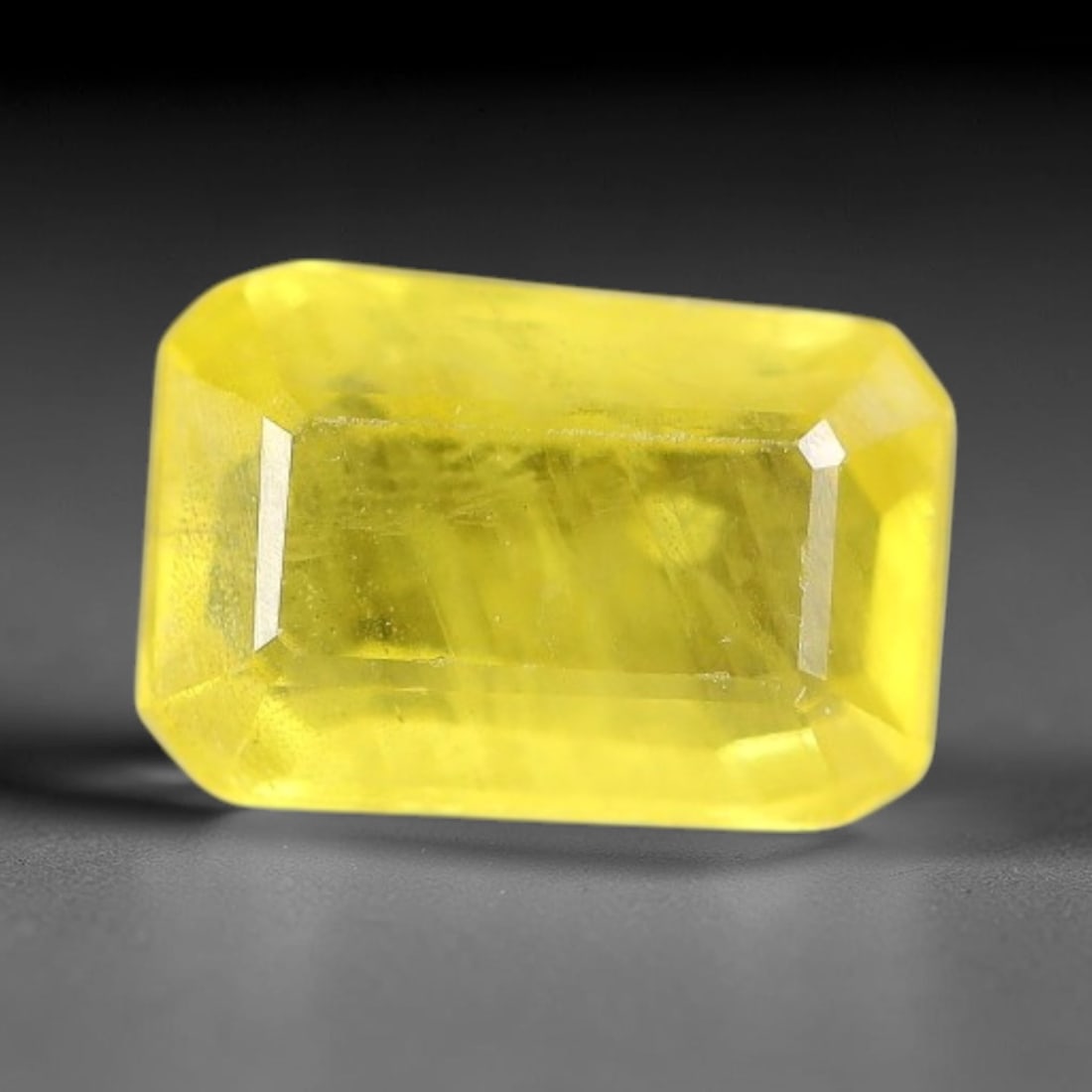 1.13 Carats Natural Yellow Sapphire Octagon Faceted Loose Gemstone, 54TT: This natural yellow sapphire features a classic octagon brilliant faceted cut, holding consistent warm golden-yellow color throughout the corundum crystal. Fine microscopic mineral specks and faint na