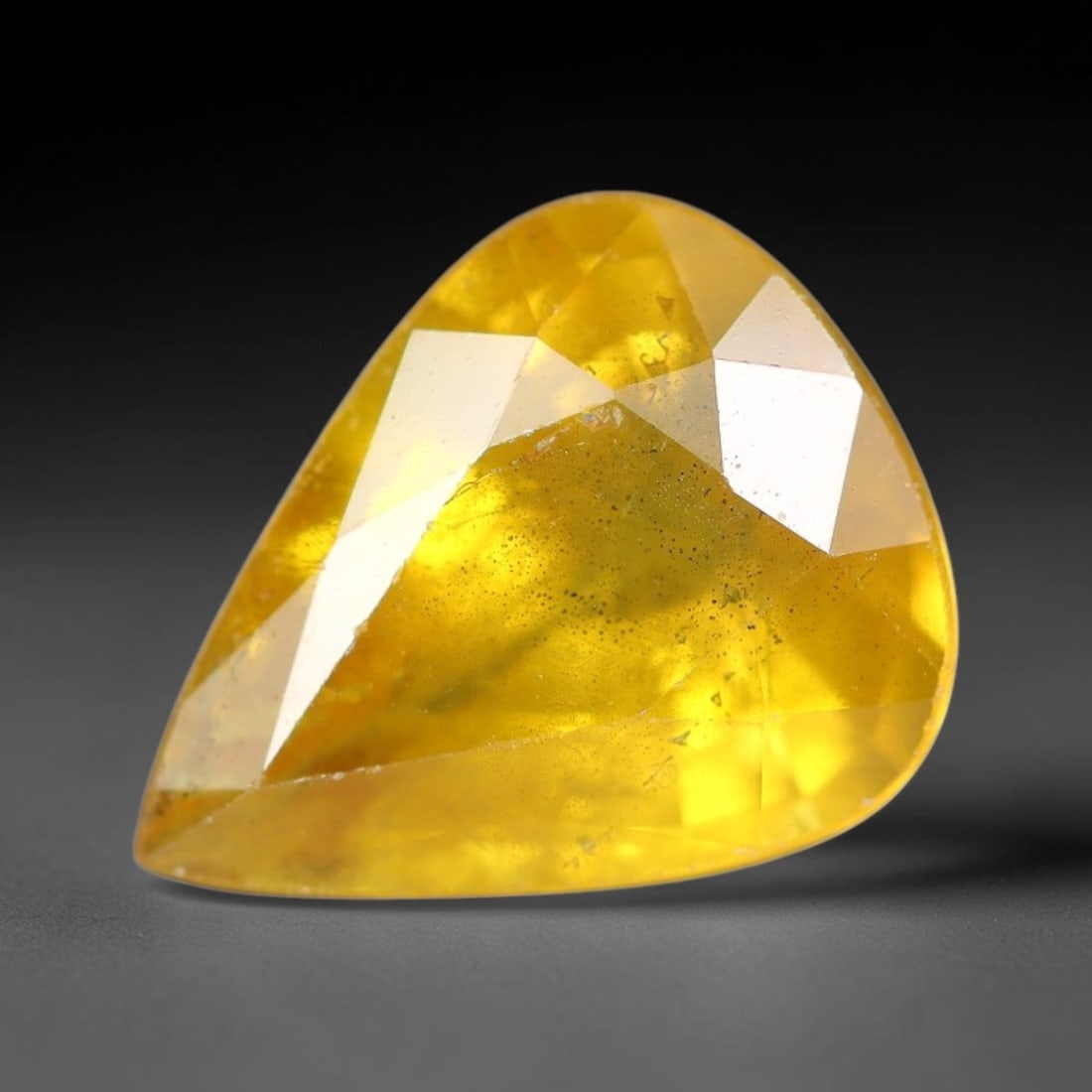 2.56 Carats Natural Yellow Sapphire Pear Faceted Loose Gemstone, 37YW: This natural yellow sapphire features a classic pear brilliant faceted cut, holding consistent warm golden-yellow color throughout the corundum crystal. Fine microscopic mineral specks and faint natur