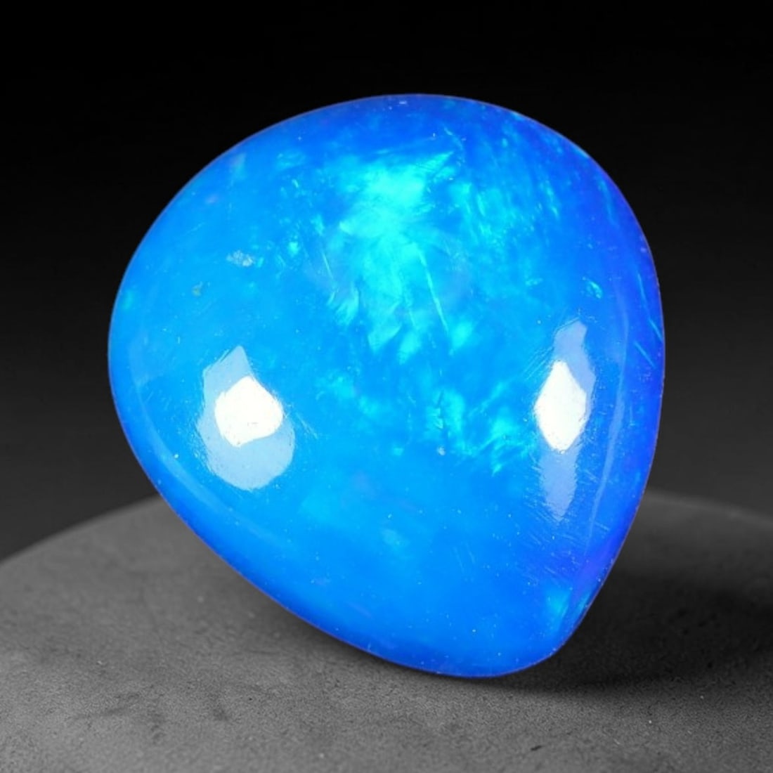 3.14ct Natural Ethiopian Welo Blue Fire Opal Cabochon Loose Gemstone, 99TH: This opal is sourced from Ethiopian Welo natural opal deposits and shaped into a smooth polished cabochon form with refined lapidary finishing work. Bright warm blue base accompanied by vivid internal