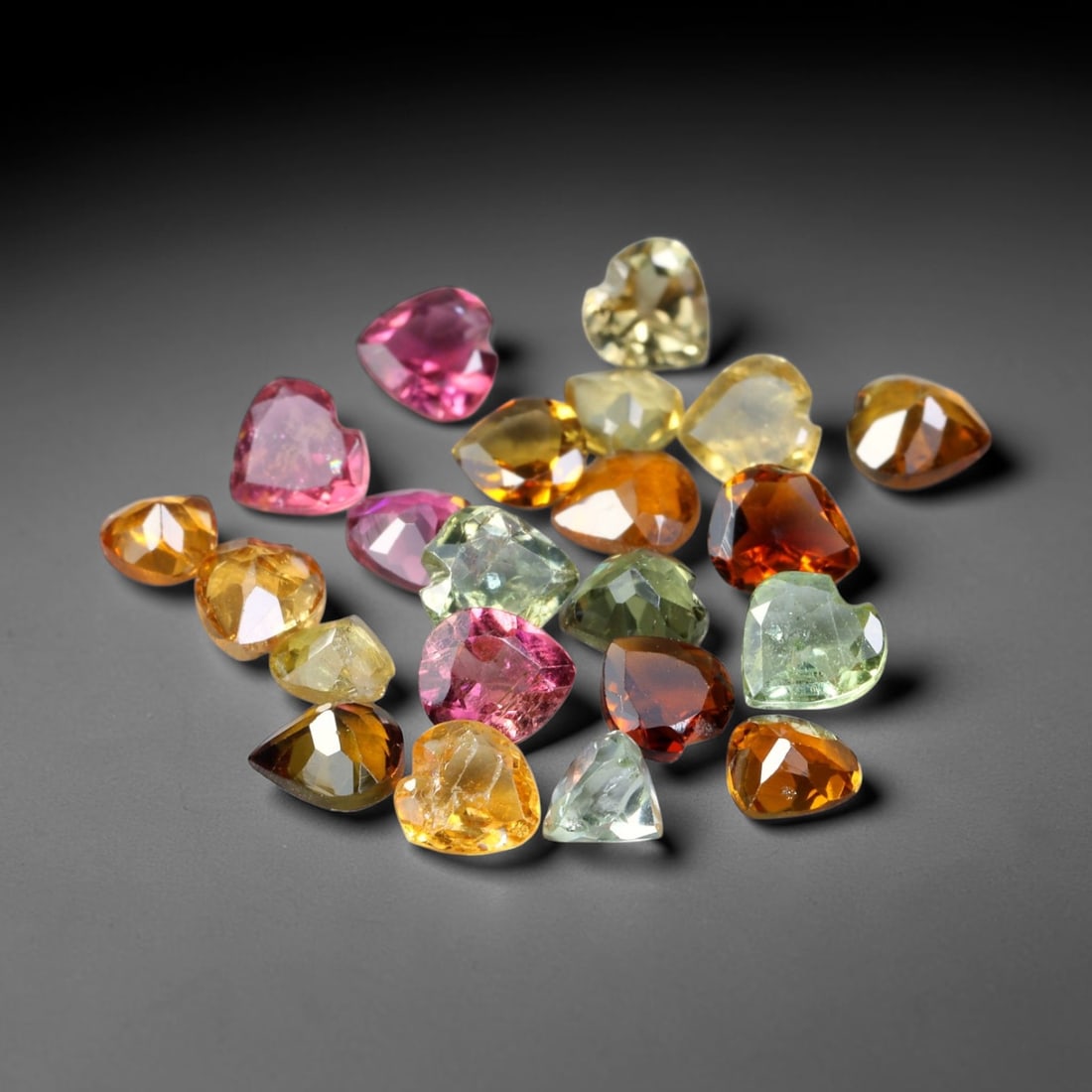 3.27ct Natural Multi Color Tourmaline Heart Cut Loose Gemstone 22pcs Parcel, 28TZ: This parcel contains 22pcs heart faceted natural tourmalines with total aggregate weight of 3.27 carats, each stone measuring 3.8x2.0mm. The gemstones display a varied palette of pink, green, yellow a