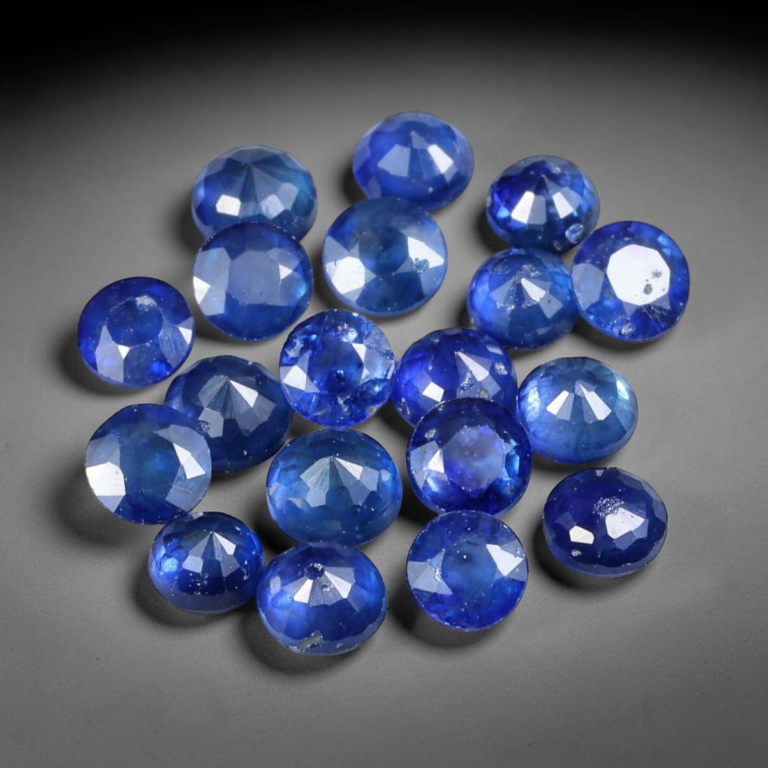 4.52ct Natural Blue Sapphire Round Cut Loose Gemstone 19pcs Parcel, 94YW: This parcel holds nineteen round faceted natural blue sapphires with a total aggregate weight of 4.52 carats, each stone measuring 3.6x2.2mm. The stones show saturated deep blue tones, containing natu
