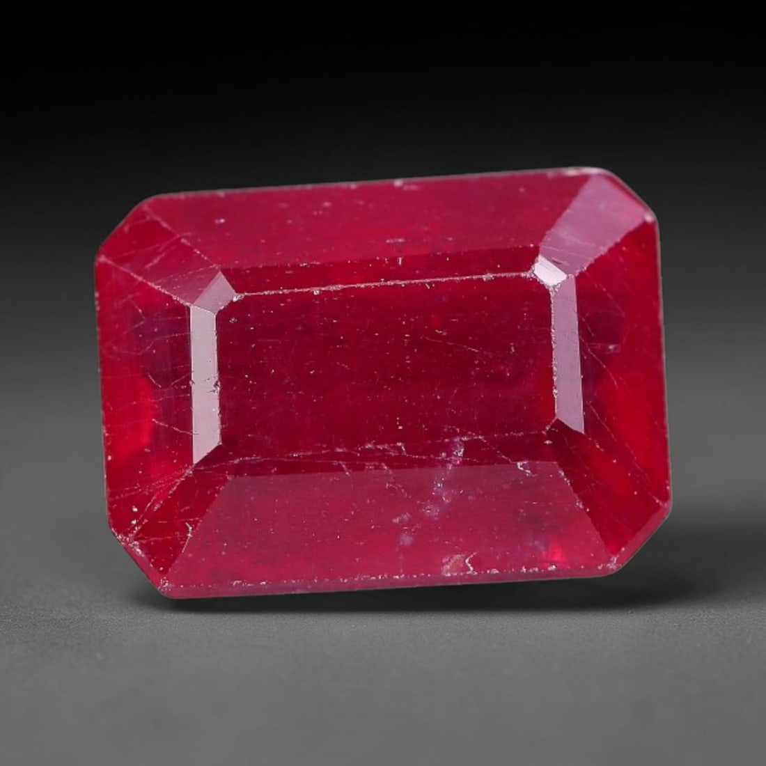 5.93 Carats Natural Madagascar Ruby Octagon Cut Loose Gemstone, 19YW: This natural Madagascar ruby is crafted into a octagon modified step cut, displaying vivid saturated crimson red color typical of Malagasy corundum. Fine scattered mineral inclusions, subtle internal 