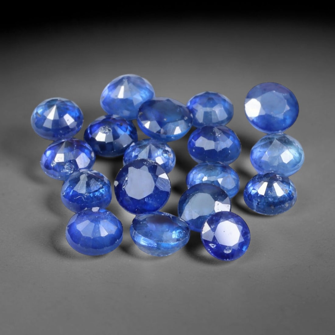 4.23ct Natural Blue Sapphire Round Cut Loose Gemstone Parcel, 10TZ: This parcel round faceted natural blue sapphires with each stone measuring 3.7x2.1mm. The gemstones show saturated deep blue colouration with natural mineral inclusions and subtle internal growth feat