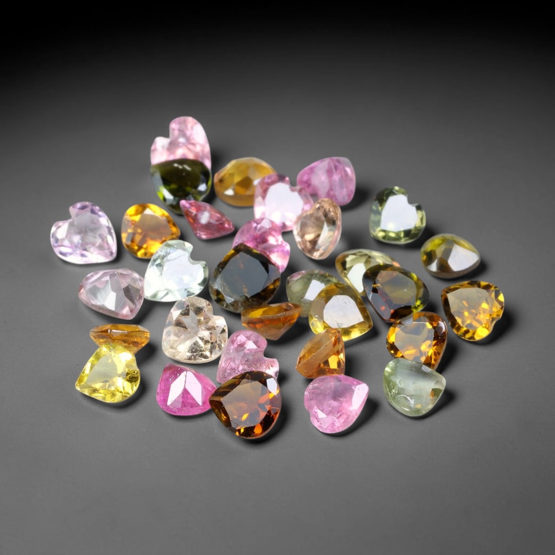 4.50ct Natural Multi Color Tourmaline Heart Cut Loose Gemstone 32pcs Parcel, 31TZ: This parcel contains 32pcs heart faceted natural tourmalines with total aggregate weight of 4.50 carats, each stone measuring 4.0x2.0mm. The gemstones display a varied palette of pink, green, yellow a